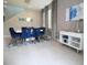 Elegant dining room with blue velvet chairs and modern light at 171 Burma St, Kissimmee, FL 34747