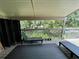 Relaxing deck overlooking the community pool and lush landscape at 122 Crown Point Cir, Longwood, FL 32779