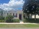 Charming one-story home with red door at 7416 Soiree Way, Reunion, FL 34747