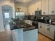 Modern kitchen with stainless steel appliances and granite countertops at 7416 Soiree Way, Reunion, FL 34747