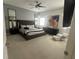 Spacious main bedroom with plush bed and ample natural light at 7416 Soiree Way, Reunion, FL 34747