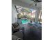 Inviting screened pool and spa with plenty of seating at 7416 Soiree Way, Reunion, FL 34747