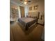 Spacious bedroom with a king-size bed and modern decor at 7416 Soiree Way, Reunion, FL 34747
