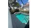 Relaxing screened-in pool and spa area at 7416 Soiree Way, Reunion, FL 34747