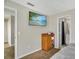 Spacious bedroom with TV, dresser, and access to bathroom at 1149 Shady Cove E Rd, Haines City, FL 33844