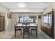 Bright dining room with lake view and wood table at 1149 Shady Cove E Rd, Haines City, FL 33844