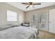 Bedroom with gray bedding and lake view at 1149 Shady Cove E Rd, Haines City, FL 33844