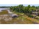 Aerial view of a lakefront property with a dock at 1149 Shady Cove E Rd, Haines City, FL 33844