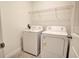 Laundry room with washer, dryer, and shelving at 6952 Sw 152Nd St, Ocala, FL 34473