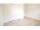 Simple bedroom with double door closet and tile floors at 6952 Sw 152Nd St, Ocala, FL 34473
