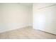 Simple bedroom with tile floors and double door closet at 6952 Sw 152Nd St, Ocala, FL 34473