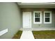 House exterior view of front door and side windows at 6952 Sw 152Nd St, Ocala, FL 34473