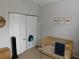 Bedroom with crib, closet, and floor lamp at 824 Grand Regency Pt # 102, Altamonte Springs, FL 32714