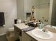 Clean bathroom with single sink vanity and bathtub shower combo at 824 Grand Regency Pt # 102, Altamonte Springs, FL 32714