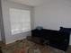 Living room with a comfy couch and large window at 824 Grand Regency Pt # 102, Altamonte Springs, FL 32714
