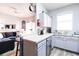 Open kitchen with stainless steel appliances and a view to living room at 244 Capri Dr, Davenport, FL 33897