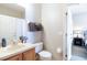 Clean bathroom with a shower, toilet, and wood vanity at 244 Capri Dr, Davenport, FL 33897