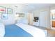 Spacious bedroom with a blue comforter, dresser, and TV at 244 Capri Dr, Davenport, FL 33897