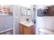 Well-lit bathroom with a sink, toilet and shower at 244 Capri Dr, Davenport, FL 33897