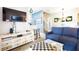 Living room features a sectional sofa and a chessboard coffee table at 244 Capri Dr, Davenport, FL 33897