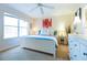 Bright bedroom with a white bed frame and large windows at 244 Capri Dr, Davenport, FL 33897