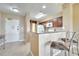 Kitchen with granite countertops and dark wood cabinets at 8801 Worldquest Blvd # 4406, Orlando, FL 32821