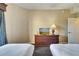 Second bedroom with two twin beds and a TV at 8801 Worldquest Blvd # 4406, Orlando, FL 32821