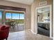 Private balcony with table and chairs, overlooking lake at 8801 Worldquest Blvd # 4406, Orlando, FL 32821