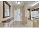 Entryway with mirror and view of kitchen and front door at 8801 Worldquest Blvd # 4406, Orlando, FL 32821
