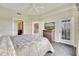 Main bedroom with king bed, dresser and access to balcony at 8801 Worldquest Blvd # 4406, Orlando, FL 32821