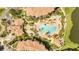 An aerial view of a community pool with plenty of lounge chairs at 8801 Worldquest Blvd # 4406, Orlando, FL 32821