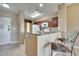 Modern kitchen features granite countertops and dark wood cabinetry at 8801 Worldquest Blvd # 4406, Orlando, FL 32821