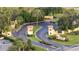 Gated community entrance with landscaping and signage at 8801 Worldquest Blvd # 4406, Orlando, FL 32821