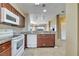 Kitchen with white appliances, granite counters, and breakfast bar at 8801 Worldquest Blvd # 4406, Orlando, FL 32821
