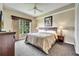 Spacious main bedroom with king-size bed and large window at 8801 Worldquest Blvd # 4406, Orlando, FL 32821