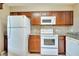 Kitchen with white appliances and granite countertops at 8801 Worldquest Blvd # 4406, Orlando, FL 32821