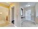 Bright entryway with tile flooring and a mirrored wall at 8801 Worldquest Blvd # 4406, Orlando, FL 32821