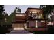 Modern two-story home with a sleek design, balcony, and attached garage at 627 Country Club Dr, Winter Park, FL 32789