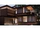 Contemporary home with dark exterior, balcony, and attached garage at 627 Country Club Dr, Winter Park, FL 32789