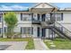 Two-story building with blue accents and balconies at 3651 N Goldenrod Rd # B107, Winter Park, FL 32792