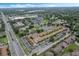 Aerial view of an apartment complex with pool and ample parking at 3651 N Goldenrod Rd # B107, Winter Park, FL 32792