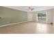 Spacious living room with tile floors and ceiling fan at 3651 N Goldenrod Rd # B107, Winter Park, FL 32792