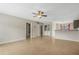 Open living area with kitchen and laundry access at 3651 N Goldenrod Rd # B107, Winter Park, FL 32792