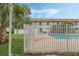 Community pool with brick patio and fence at 3651 N Goldenrod Rd # B107, Winter Park, FL 32792