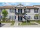 Two-story building with blue accents and balconies at 3651 N Goldenrod Rd # B107, Winter Park, FL 32792