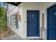 Private entrance with blue door and walkway at 3651 N Goldenrod Rd # B107, Winter Park, FL 32792