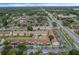 Aerial perspective of apartment complex featuring a pool and parking lot at 3651 N Goldenrod Rd # B107, Winter Park, FL 32792
