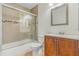 Clean bathroom with a tub, shower, and wood vanity at 3651 N Goldenrod Rd # B107, Winter Park, FL 32792