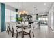 Elegant dining area with a glass-top table and modern chairs at 1870 Summer Dr, Davenport, FL 33897