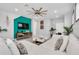 Spacious living room featuring a sectional sofa and a large TV at 1870 Summer Dr, Davenport, FL 33897